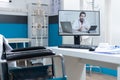 Compute screen with remote doctor talking during online videocall