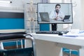 Compute screen with remote therapist doctor explaining during online videocall