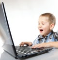 Computer addiction emotional boy with laptop Royalty Free Stock Photo