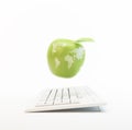 Computer and an apple with the world map Royalty Free Stock Photo