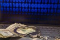 Computer with binary data on the screen, handcuffs and money on the keyboard Royalty Free Stock Photo