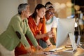 Computer, business and a female leader with her team, working overtime together in the office at night. Collaboration Royalty Free Stock Photo