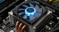Computer central processing unit cooler with blue LED fan mounted on a motherboard system Royalty Free Stock Photo