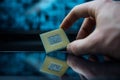 Computer chip in hands. A chipset is a set of electronic component that is integrated and flows data between the processor. Royalty Free Stock Photo
