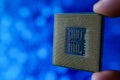 Computer chip in hands. A chipset is a set of electronic component that is integrated and flows data between the processor. Royalty Free Stock Photo