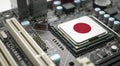 Computer chip on PCB board with Japan flag. CPU Central processing Unit or GPU microchip on a motherboard Royalty Free Stock Photo