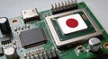 Computer chip on PCB board with Japan flag. CPU Central processing Unit or GPU microchip on a motherboard Royalty Free Stock Photo