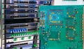 Computer circuit Board on background of mulitplexor frequency DWDM on optical modulations. Multiservise platform Royalty Free Stock Photo