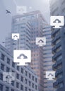 Computer cloud upload icons in city