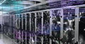Computer code and data processing image over server racks in data center Royalty Free Stock Photo
