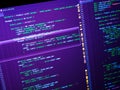 Computer code on the screen (web developing). PHP code on purple background Royalty Free Stock Photo