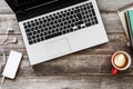 Computer with coffee on wooden table Royalty Free Stock Photo