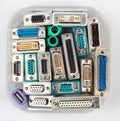 Computer connectors and adapters in plastic jar