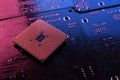 Computer cpu processor chip on circuit board ,motherboard background. Close-up. With red-blue lighting Royalty Free Stock Photo