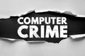 COMPUTER CRIME text on torn paper background, highlighting cybersecurity, hacking, and digital fraud issues. Symbolic of internet Royalty Free Stock Photo