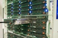 The computer database server is installed in the server datacenter. Powerful equipment is installed in the rack. Replacing the