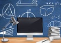 Computer Desk foreground with blackboard graphics of mathematical diagrams Royalty Free Stock Photo