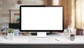 Computer display mockup. Modern studio work desk with plant, keyboard Royalty Free Stock Photo