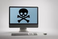 Computer displaying internet fraud and scam warning on screen