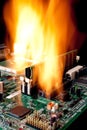 A computer electronic mother board on fire