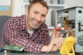computer engineer taking apart home computer Royalty Free Stock Photo