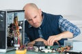 computer engineer working on broken console Royalty Free Stock Photo