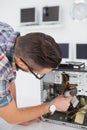 Computer engineer working on broken console Royalty Free Stock Photo