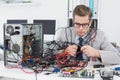 Computer engineer working on broken console Royalty Free Stock Photo