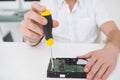 Computer engineer working on broken cpu with screwdriver Royalty Free Stock Photo