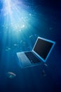 Computer failure concept with laptop on water Royalty Free Stock Photo