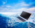 Computer failure concept with laptop on water Royalty Free Stock Photo