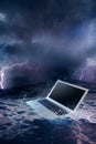 Computer failure concept with laptop on water Royalty Free Stock Photo