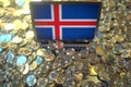 Computer with flag of Iceland and pile of bitcoins. National regulations and cryptocurrency mining conceptual 3d