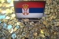 Computer with flag of Serbia and pile of bitcoins. National regulations and cryptocurrency mining conceptual 3d