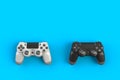 Computer game competition. Gaming concept. White and black joystick isolated on blue background Royalty Free Stock Photo