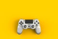 Computer game competition. Gaming concept. White joystick isolated on yellow background Royalty Free Stock Photo