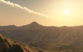 Sun and cloudscape over a mountain landscape