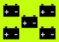 Five simple icons symbols shapes of a car cell battery against a bright luminous lime green yellow backdrop