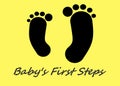 A pair of all black feet outline, one is bigger than the other, against a yellow backdrop. The words baby`s first steps Royalty Free Stock Photo