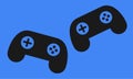A pair of game console controllers against a blue backdrop