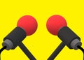 A pair of identical 3D red microphones with grey handle and black wiring cable stand bright yellow backdrop