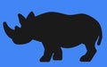 A Rhinoceros all black Silhouette shape against a blue backdrop Royalty Free Stock Photo