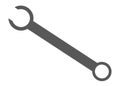 A simple simplified dark grey fixed sized spanner wrench tool white backdrop Royalty Free Stock Photo