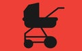 A single baby pram stroller set against a red backdrop Royalty Free Stock Photo