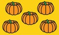 Five orange pumpkin fruit against a yellow backdrop Royalty Free Stock Photo