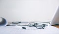 Computer glasses and documents on the desk