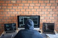 Computer hacker or cyber attack concept, Dangerous hooded hacker using multiple computers typing bad data into online system the Royalty Free Stock Photo