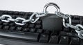 Computer hacker espionage cyberattack, keyboard with chain Royalty Free Stock Photo