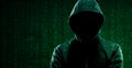 Computer Hacker in Hoodie. Obscured Dark Face. Hacker Attack, Virus Infected Software, Dark Web and Cyber Security Royalty Free Stock Photo