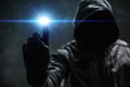 Computer hacker in hoodie using virtual screen. Database hacking, computer virus malware and cybersecurity concept